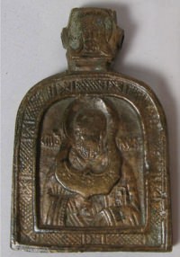 Small Russian pectoral brass plaquette icon depicting Saint Nicholas of Myra